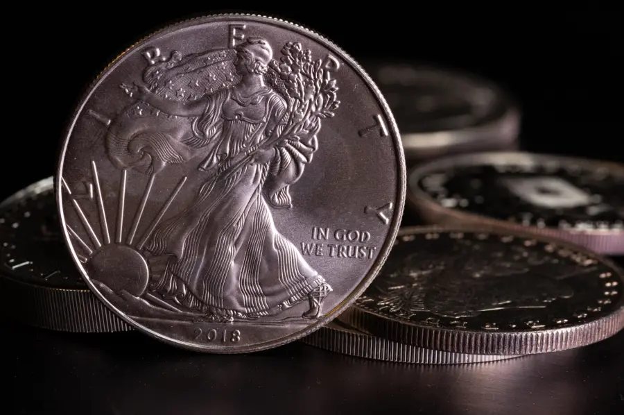 Silver coins including Morgan dollars and an American Silver Eagle