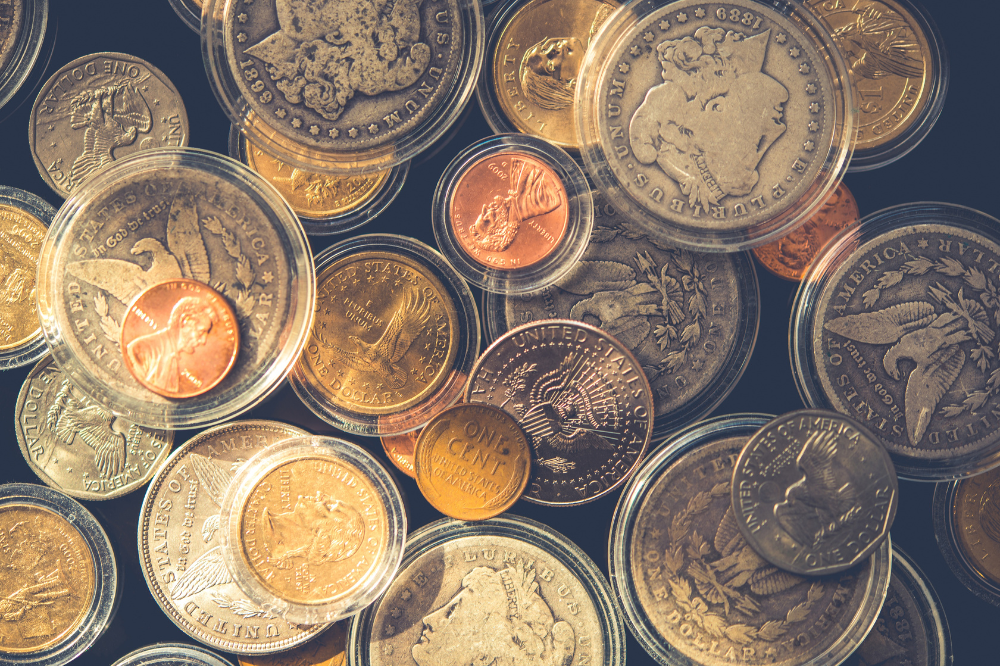 Collection of U.S. silver and gold coins in protective holders – Coin Buyers in Tyler.